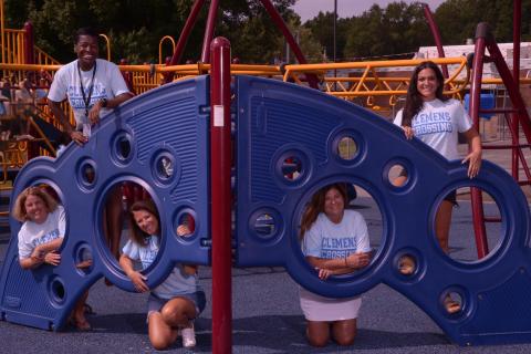 Photo of 5 First Grade staff on the playground.
