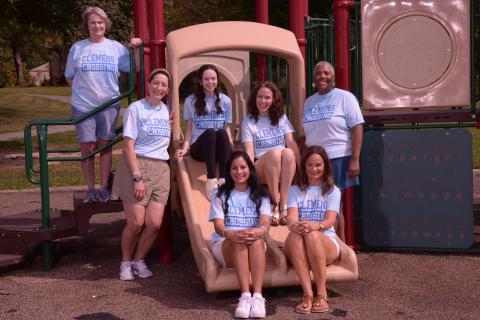 Photo of 7 Kindergarten staff on the playground.