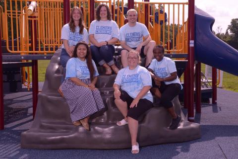 Photo of 6 Third Grade staff on the playground.
